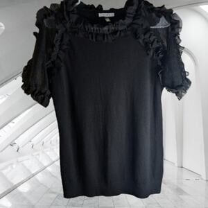 Sioni Medium black with ruffle accent polyester blend stretch woman's knit top.